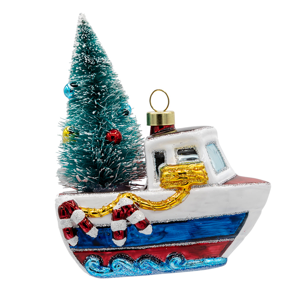 Merry Motorboat ornament. A decorated Christmas tree sits on the back of a sailboat. View of front.