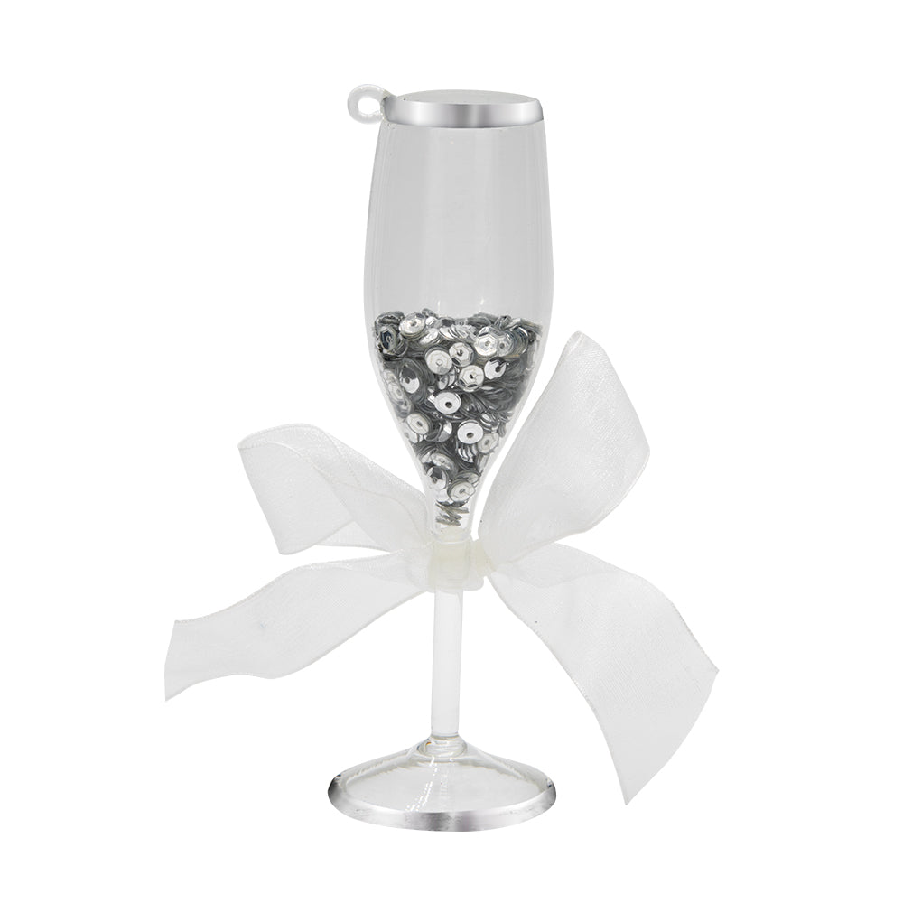 Wedding Champagne Toast ornament. A champagne flute filled with silver sequins and a white ribbon tied around the stem. View of back.