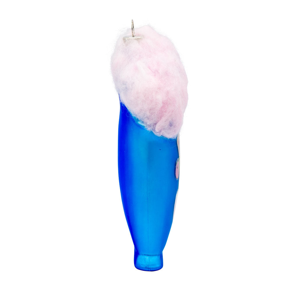 Fluffy Stuff ornament. Fluffy Stuff cotton candy bag ripped open with fluffy pink cotton candy coming out the top. View of left side.