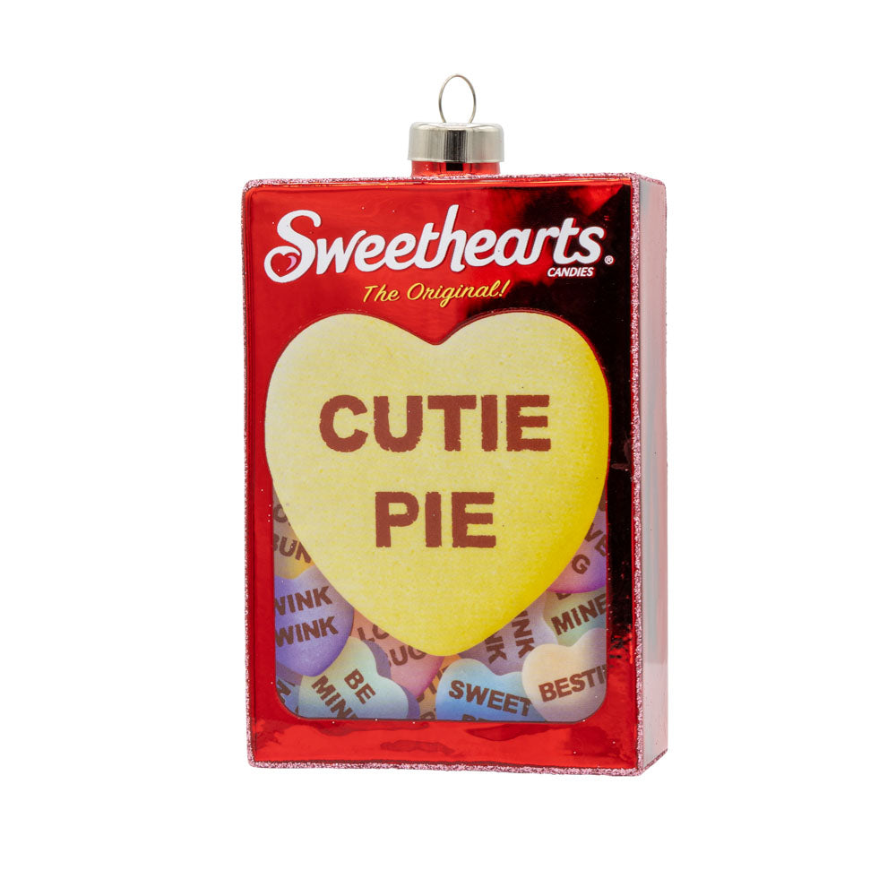 Sweethearts Candy Box ornament. Yellow heart that says "Cutie Pie." Viewed from front.