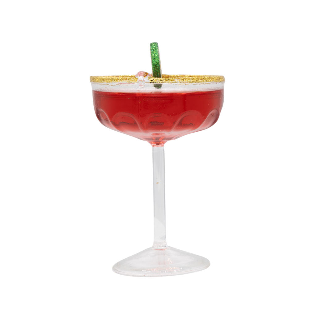 Cosmo ornament. Cosmo cocktail with a lime wheel and gold sugared rim. View of right side.