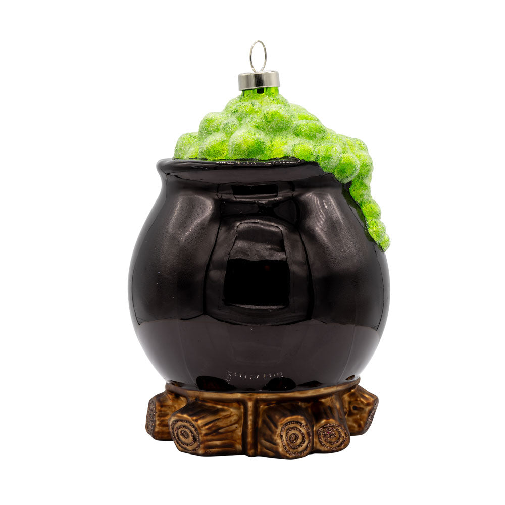 Spooky Cauldron ornament. A black cauldron over a fire with green foam coming out the top. View of back.