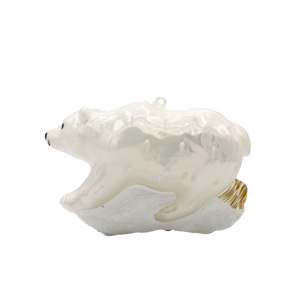 Arctic Stroll ornament. A polar bear walks through the snow over a log. View of back.