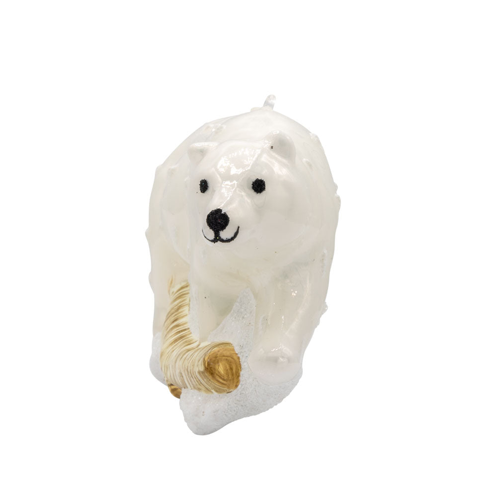 Arctic Stroll ornament. A polar bear walks through the snow over a log. View of right side.