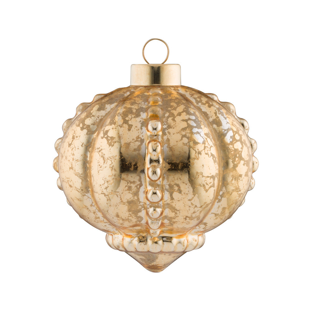 A gold ornate pattern peak out of this shiny gold glass onion.