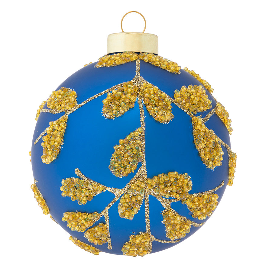 A gold microbead vine pattern delicately wraps around our satin blue glass round.