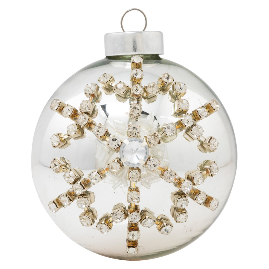 A gorgeous gemstone snowflake shines as the star of this metallic silver round, adding seriously show-stopping sparkle to any holiday décor!