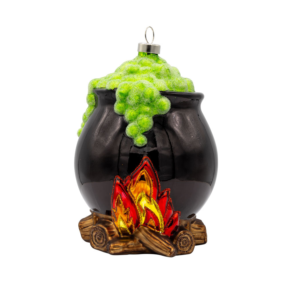 Spooky Cauldron ornament. A black cauldron over a fire with green foam coming out the top. View of front. 