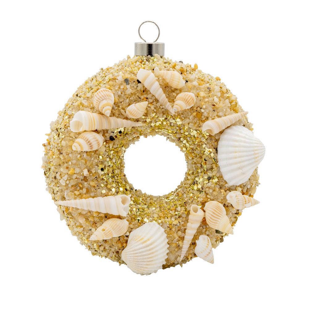 Shell Wreath ornament. A sand covered wreath adorned with seashells. View of front. 