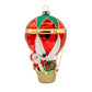 Hot Air Balloon Santa ornament. Santa is seen in a hot air balloon full of presents. View of front. 