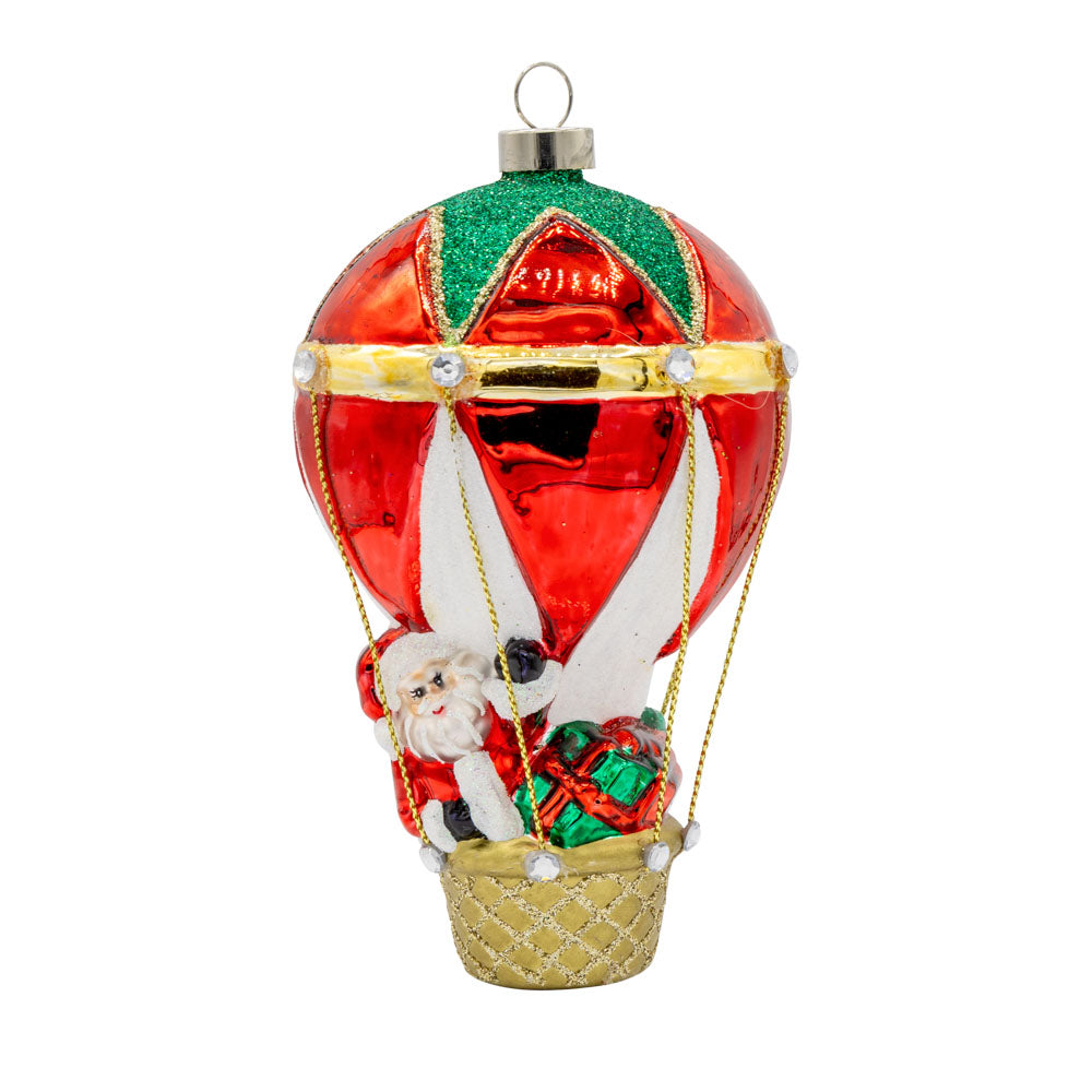 Hot Air Balloon Santa ornament. Santa is seen in a hot air balloon full of presents. View of front. 