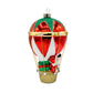 Hot Air Balloon Santa ornament. Santa is seen in a hot air balloon full of presents. View of left side.