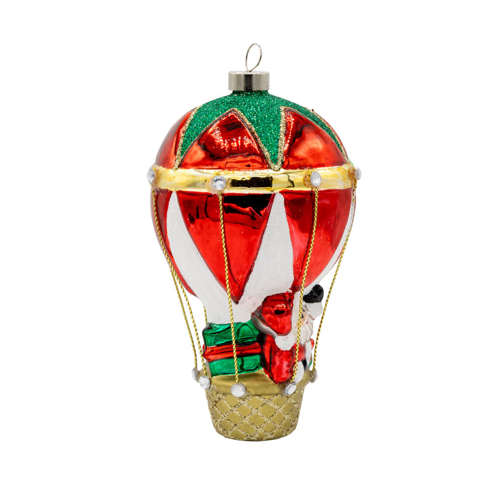 Hot Air Balloon Santa ornament. Santa is seen in a hot air balloon full of presents. View of left side.