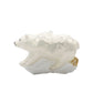 Arctic Stroll ornament. A polar bear walks through the snow over a log. View of back.