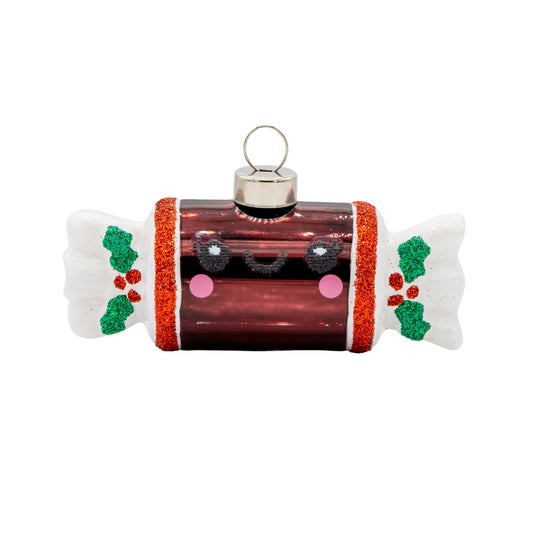 This Cheerful Tootsie Roll ornament with huge smile, viewed from the front.