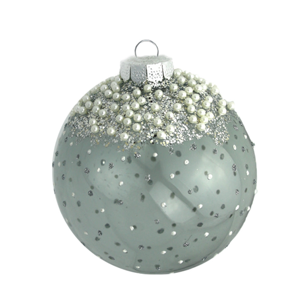 Accented with delicate pearls and glitter, this glass round is completed with a pearlized silver finish.