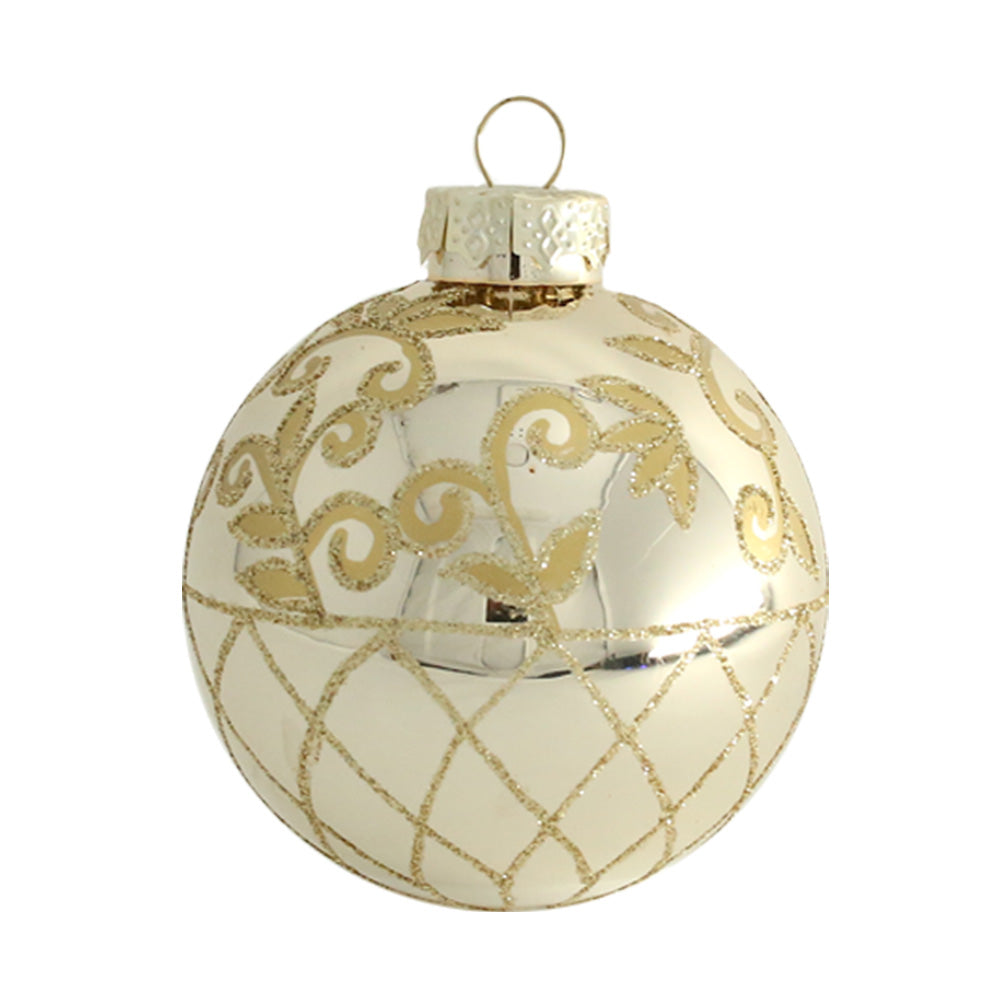 Golden and shiny, this glass round is gilded with gold glitter accenting a delicate filigree and painted glitter netting.