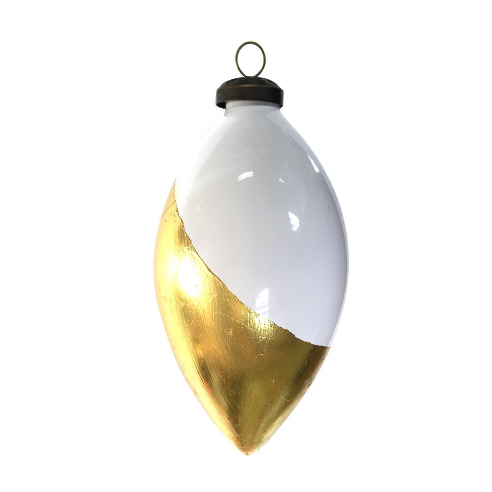 A shiny, opal glass tulip in white with ravishing golden foil accenting creating a dipped in gold appearance.