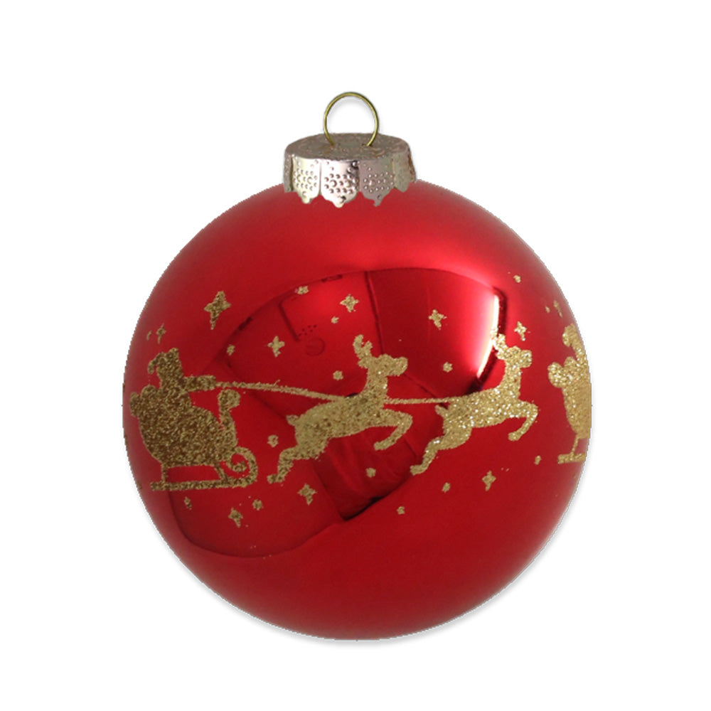 In classic red, this glass ornament is adorned with a gold glitter silhouette of Santa and his reindeer's flying through the starry night.