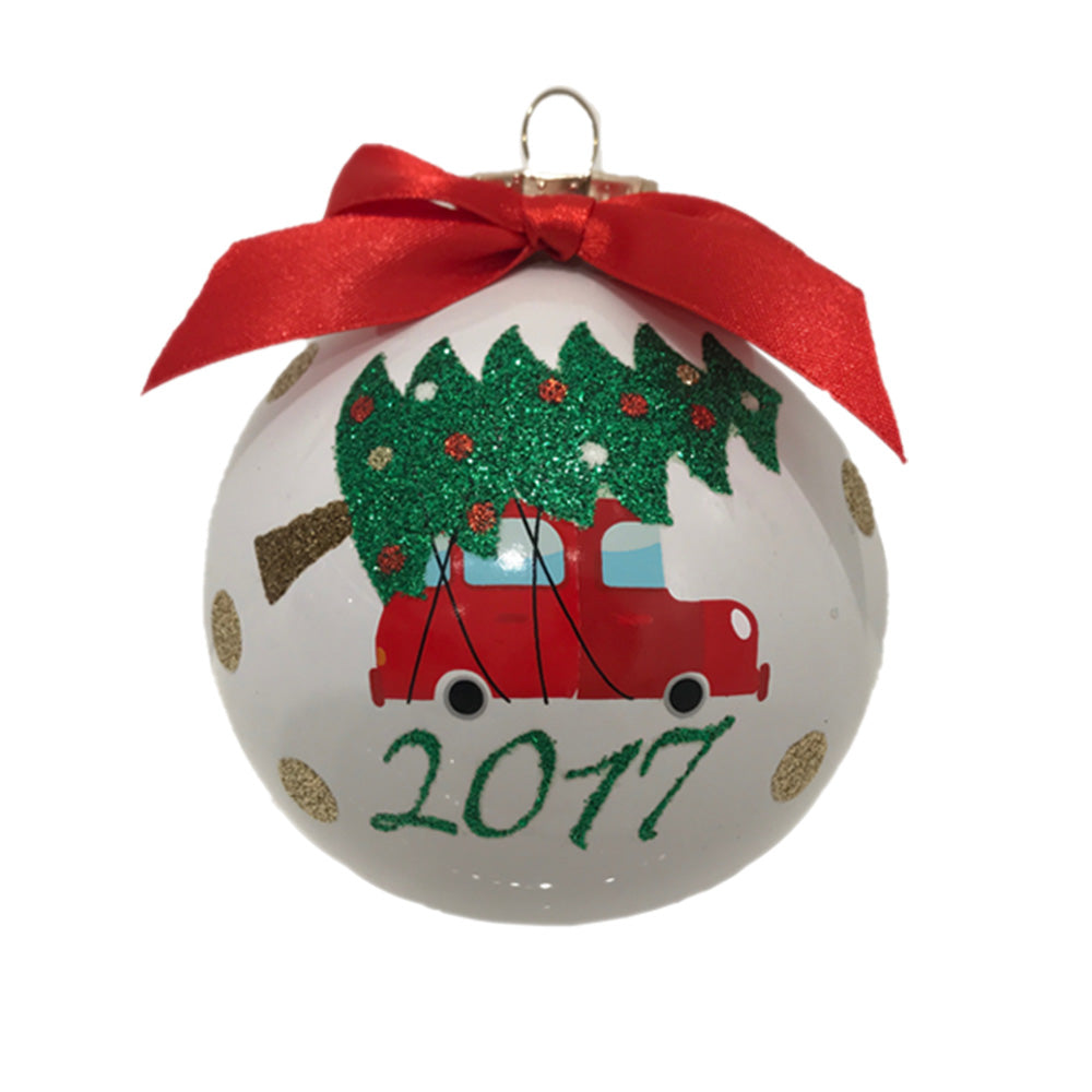 Inspired by memories of bringing home a Christmas tree, this white opal glass round is detailed in glitter and topped with a satiny bow.