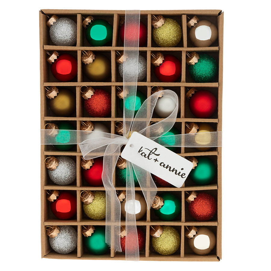 This classic set of red, gold, green and silver glass ornaments will pop on your Christmas tree this year. These ornaments are the perfect size for filling a tree or decorating your Holiday table.