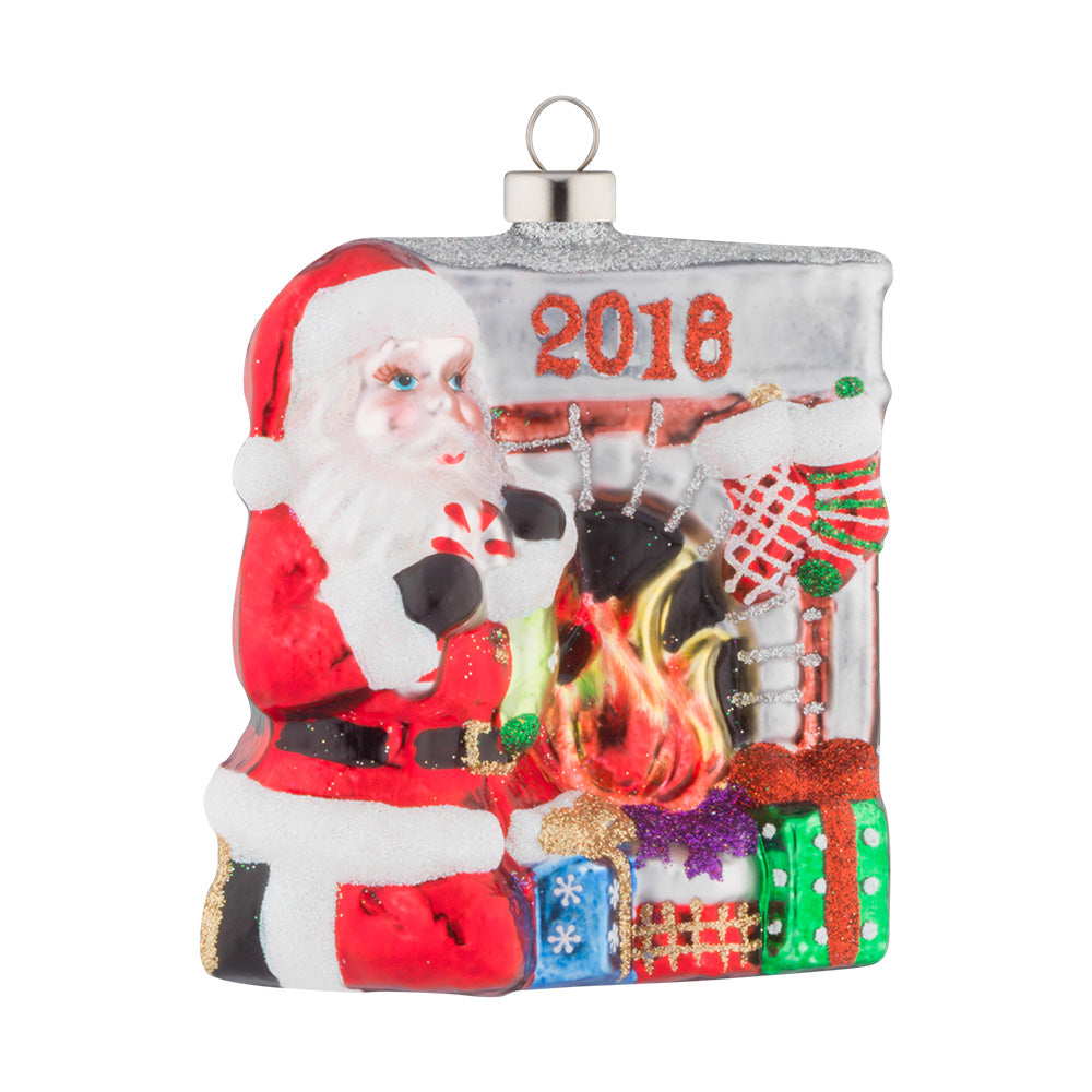 You can almost hear the crackle of burning logs in the fireplace as Santa sits by a bunch of presents.