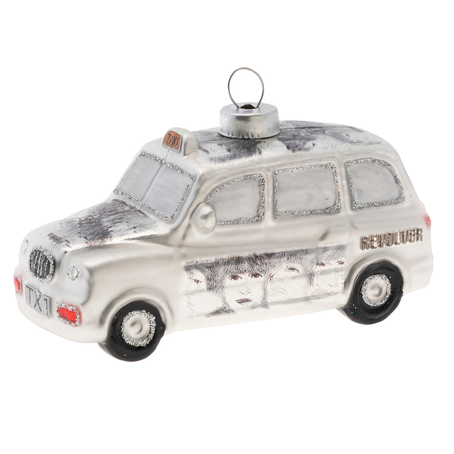 Celebrate all the fun times you've spent listening to the Beatles with this Beatles Cab glass ornament. The cab displays the iconic graphics from the album "Revolver".