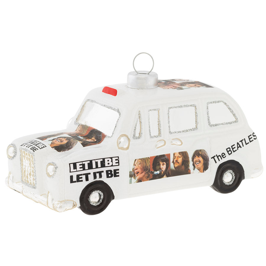 Cherish the times you’ve spent riding around listening to The Beatles with this Beatles Cab glass ornament. The cab displays the iconic graphics from the album "Let It Be".  