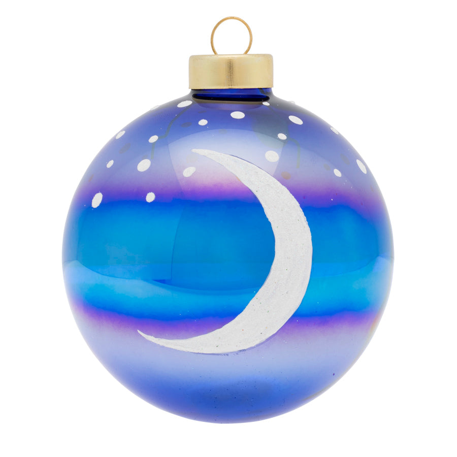 Our blue iridescent round features a modern illustration of the moon and a star filled night sky.