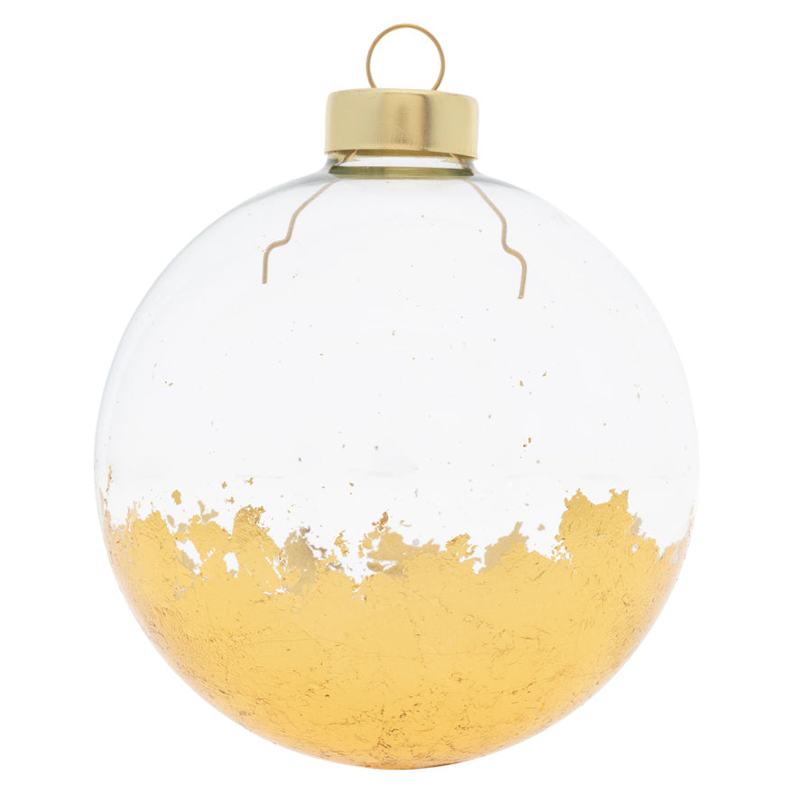 Carefully applied gold foil coats the base of this modern clear round to create a work of art for your tree!