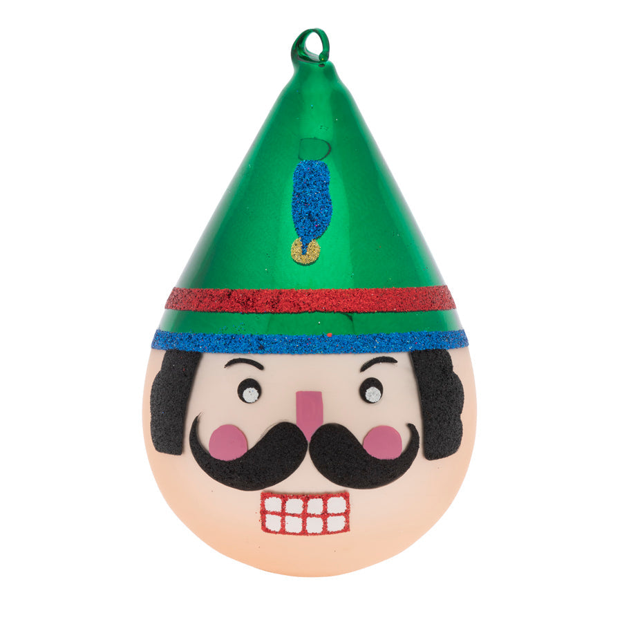 Our modern tear drop ornament comes to life with a  noble Nutcracker face and glittery feather embellished hat.