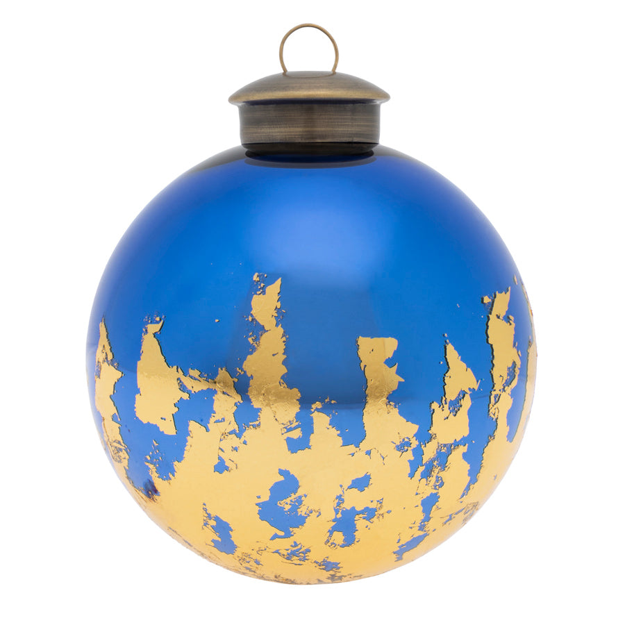 A distressed gold foil pattern skillfully covers the base of this deep blue ornament.