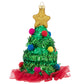 With tinseled cone, pom pom ornaments and a tulle skirt, this glittered tree is joyful from top to bottom.