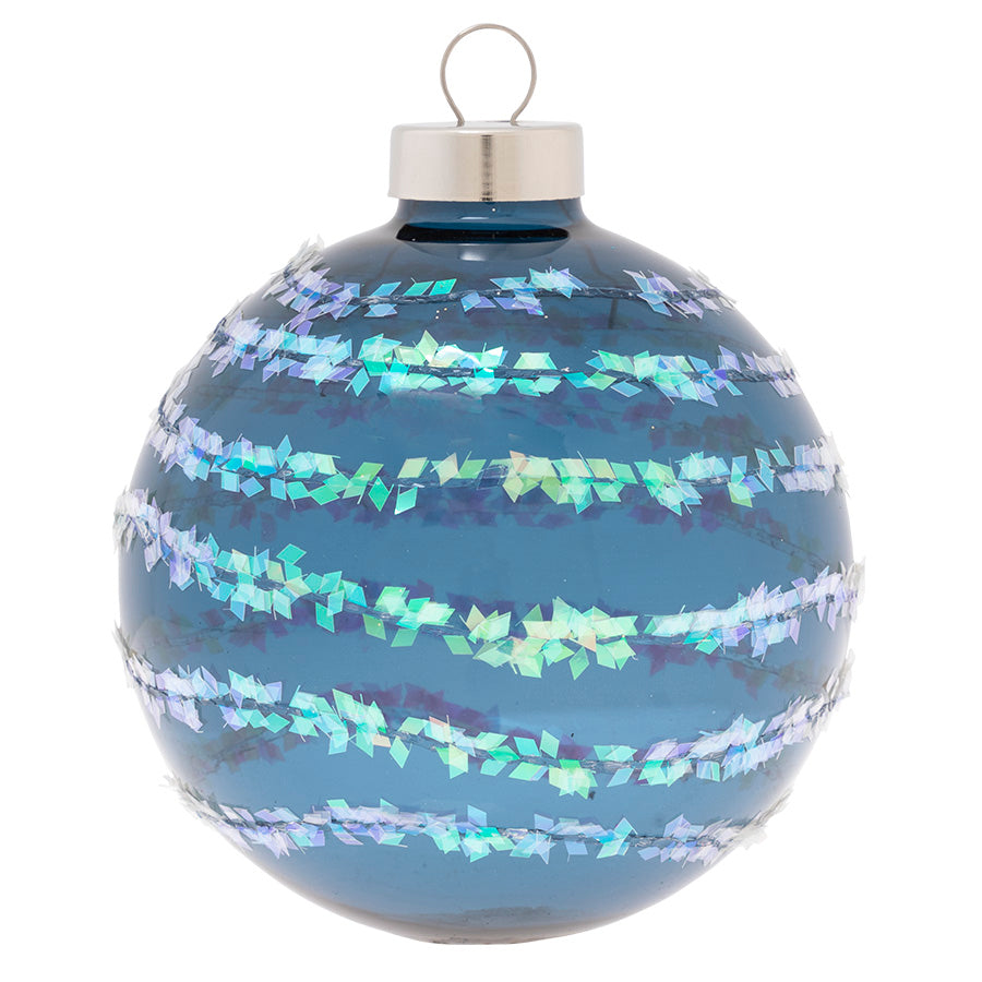 Like frost on an frozen lake, this deep blue glass round is covered in trails of shimmering icy white glitter.