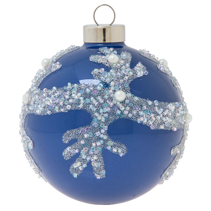 In pearls and translucent beads, textured coral takes shape against this ocean-blue glass round. 