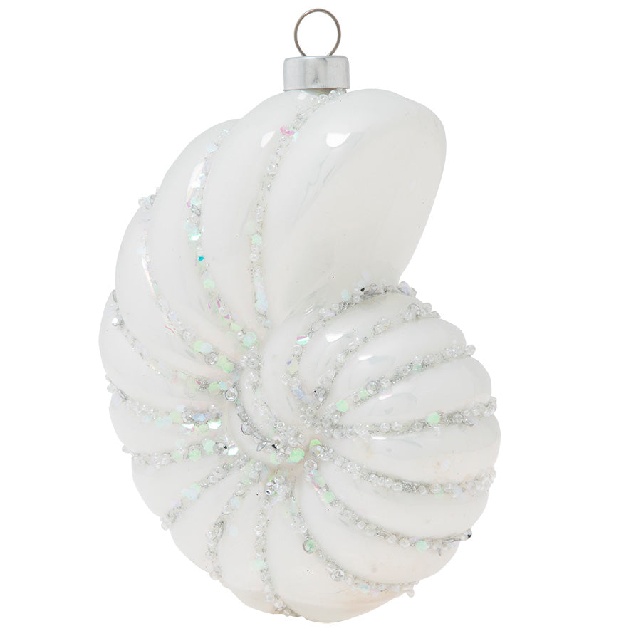 Shimmering in iridescent white glass and glitter, this sparkling spiral shell is a reflection of the peaceful beauty of a seashore.