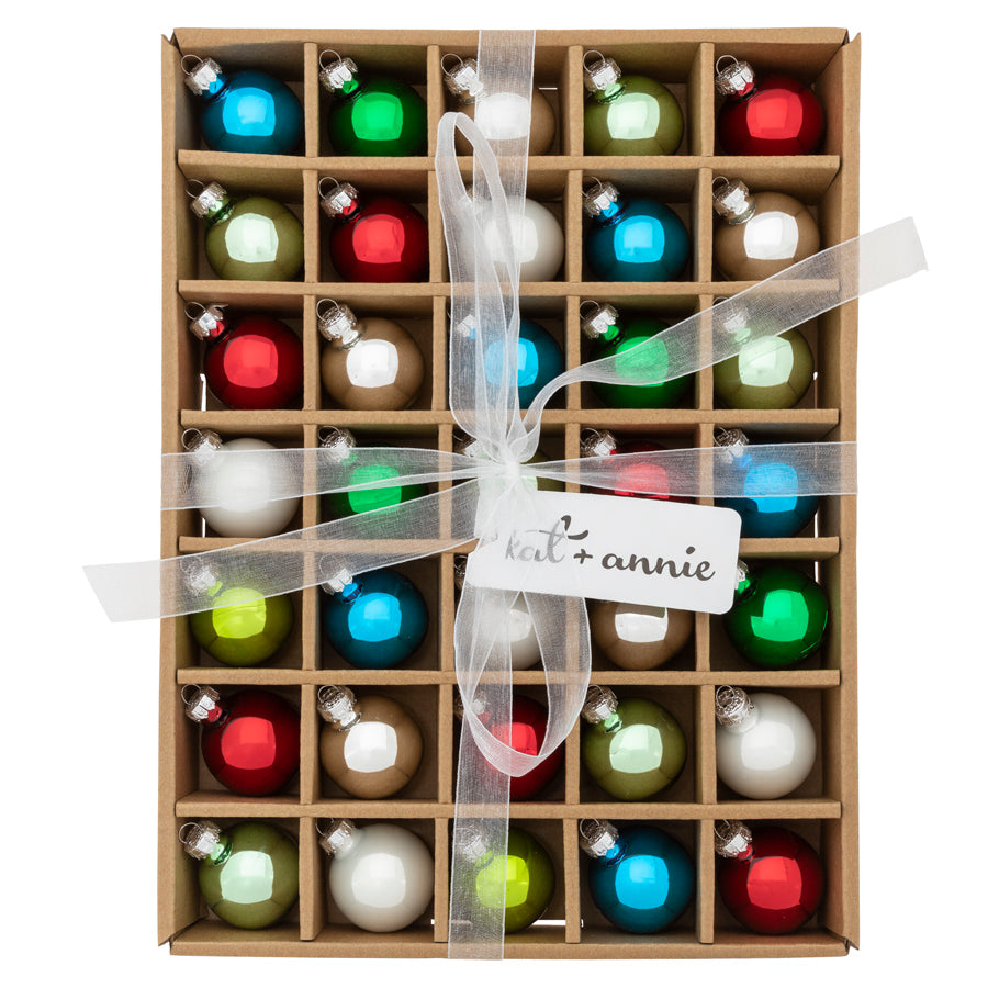 This set of 35 rounds shines in a classic holiday palette of reds, greens, blues, and golds. 