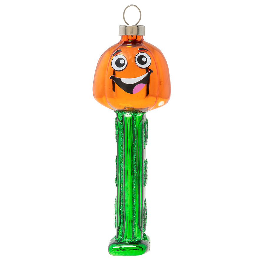 A goofy jack-o-lantern grins from his perch atop a bright green PEZ dispenser in this officially licensed PEZ ornament.   