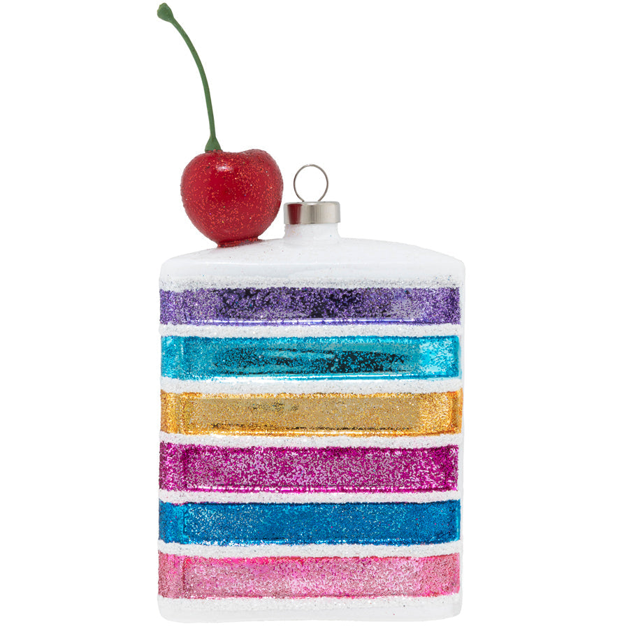 A delicious jewel toned rainbow cake is finished with a shimmering cherry on top to delight any baker or sweet tooth!